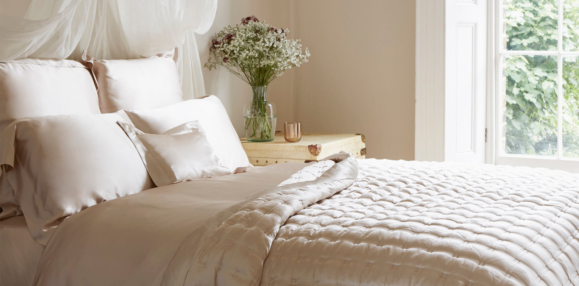 Fitted sheet made from blush colored silk fabric