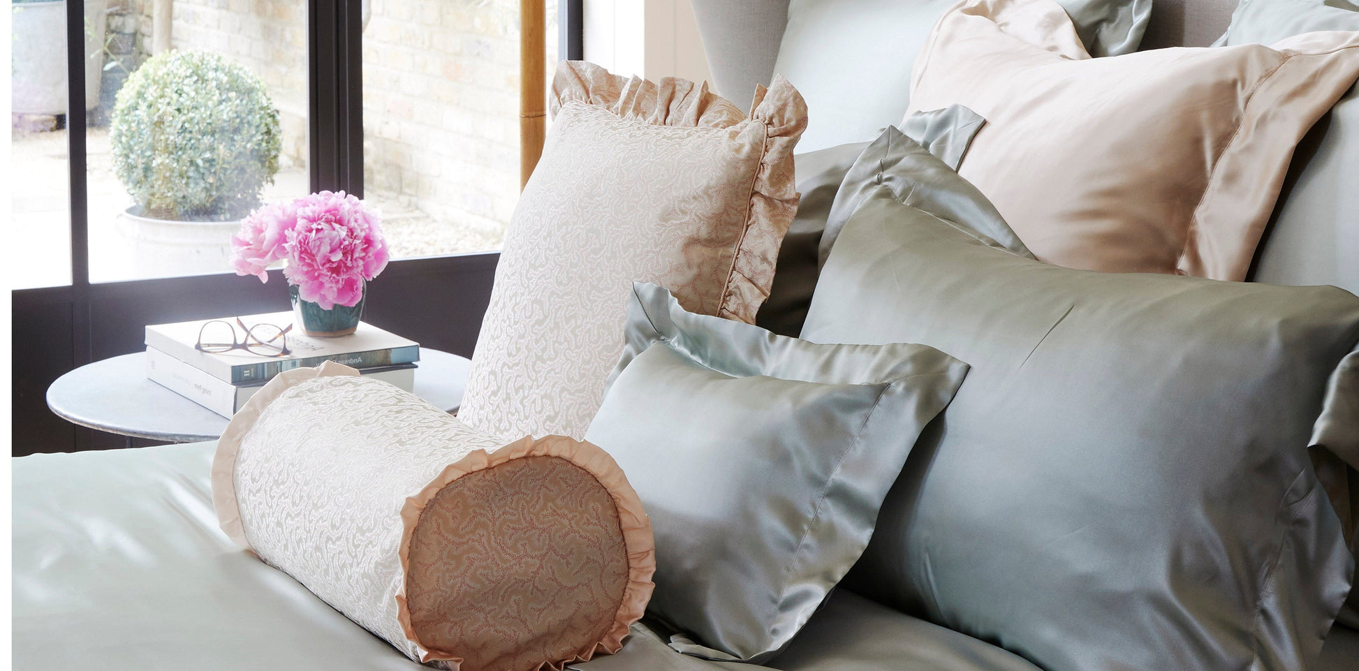 Coral pink fern patterned silk bolster cushion